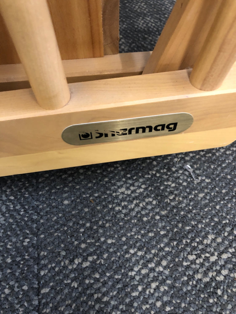 BLONDE WOODEN ROCKING CHAIR W/LEVER TO LOCK & BEIGE CUSHION.