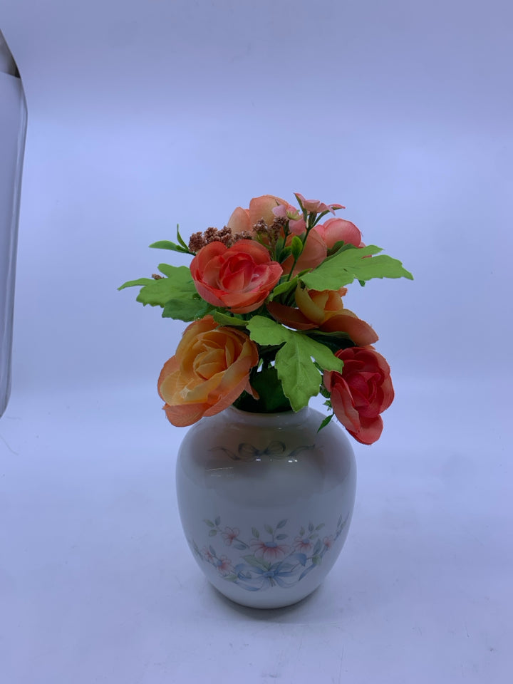 FAUX ORANGE FLORAL IN ROUND PINK FLORAL PRINCESS HOUSE VASE.