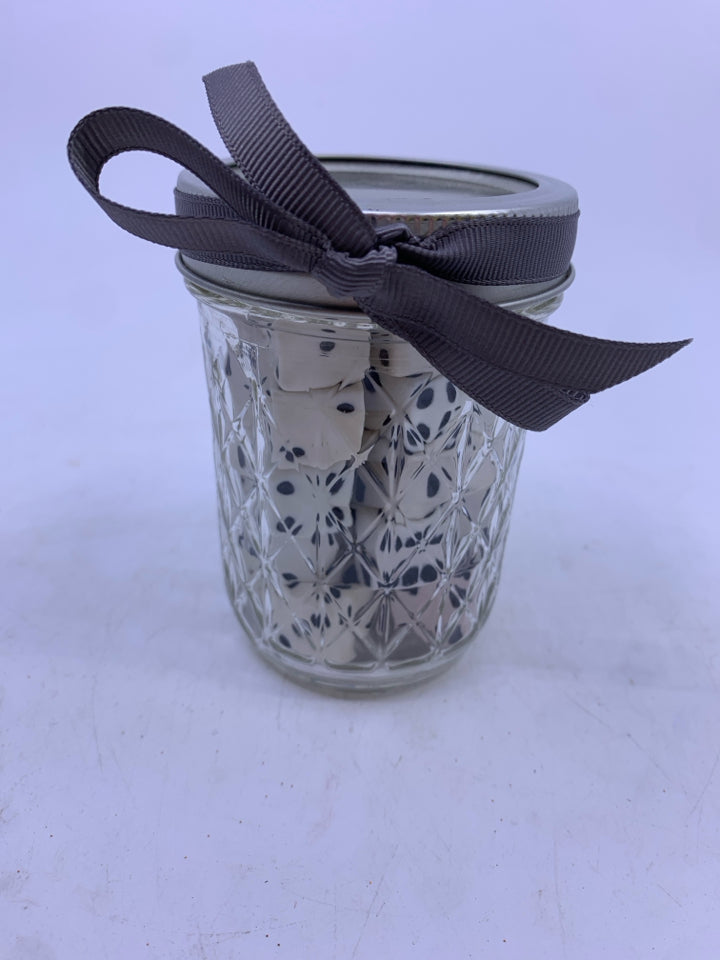 BALL JAR W/LID FILLED WITH DICE.