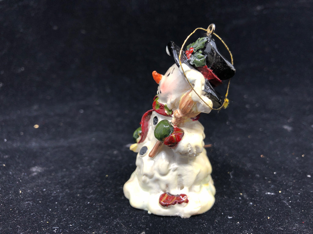 SNOWMAN HOLDING BROOM ORNAMENT.