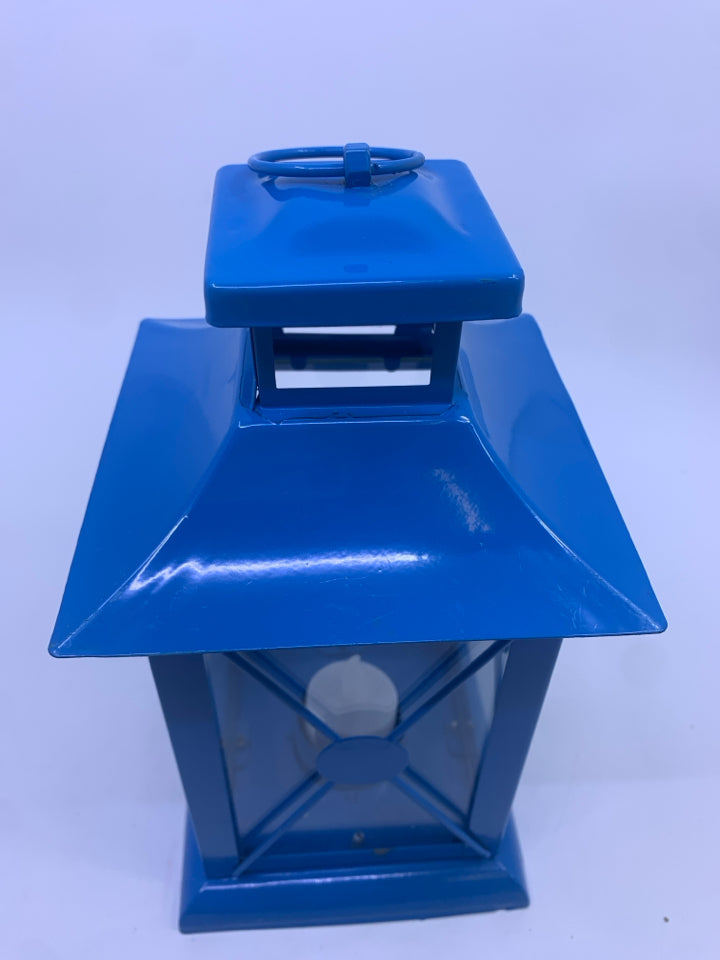 BLUE METAL TEA LIGHT LANTERN.