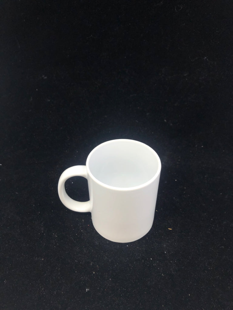 WHITE CERAMIC MUG.