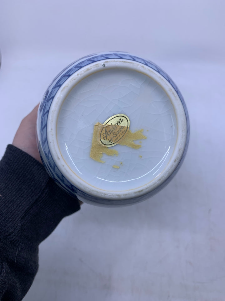 WHITE W/ BLUE FLORAL CERAMIC VASE.