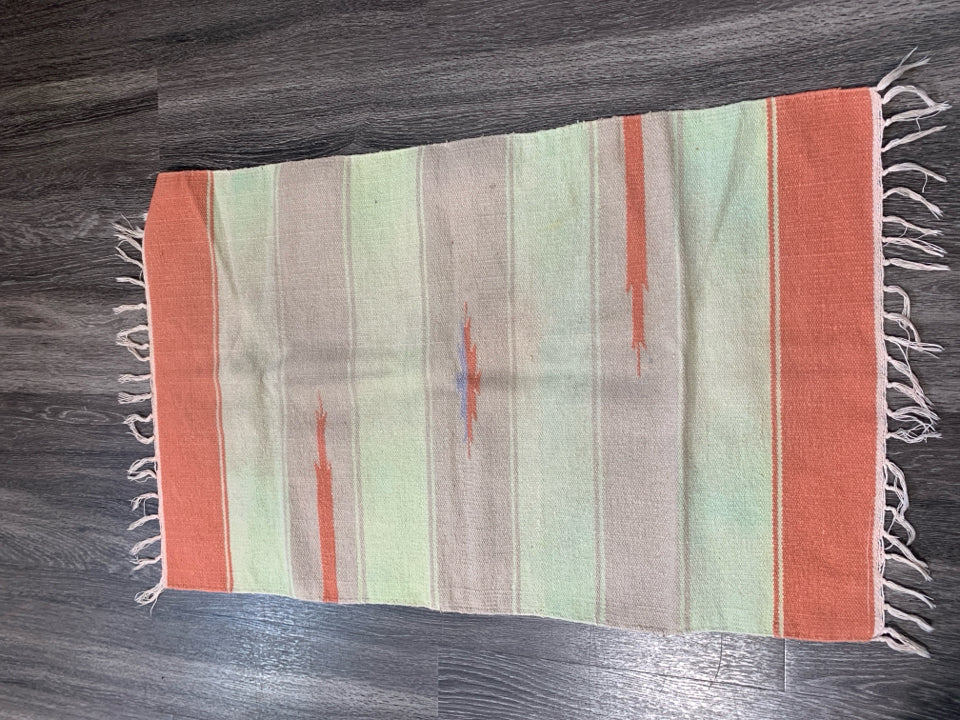 ASSORTED COLORS WOVEN AZTEC PATTERN RUG W/ TASSELS.