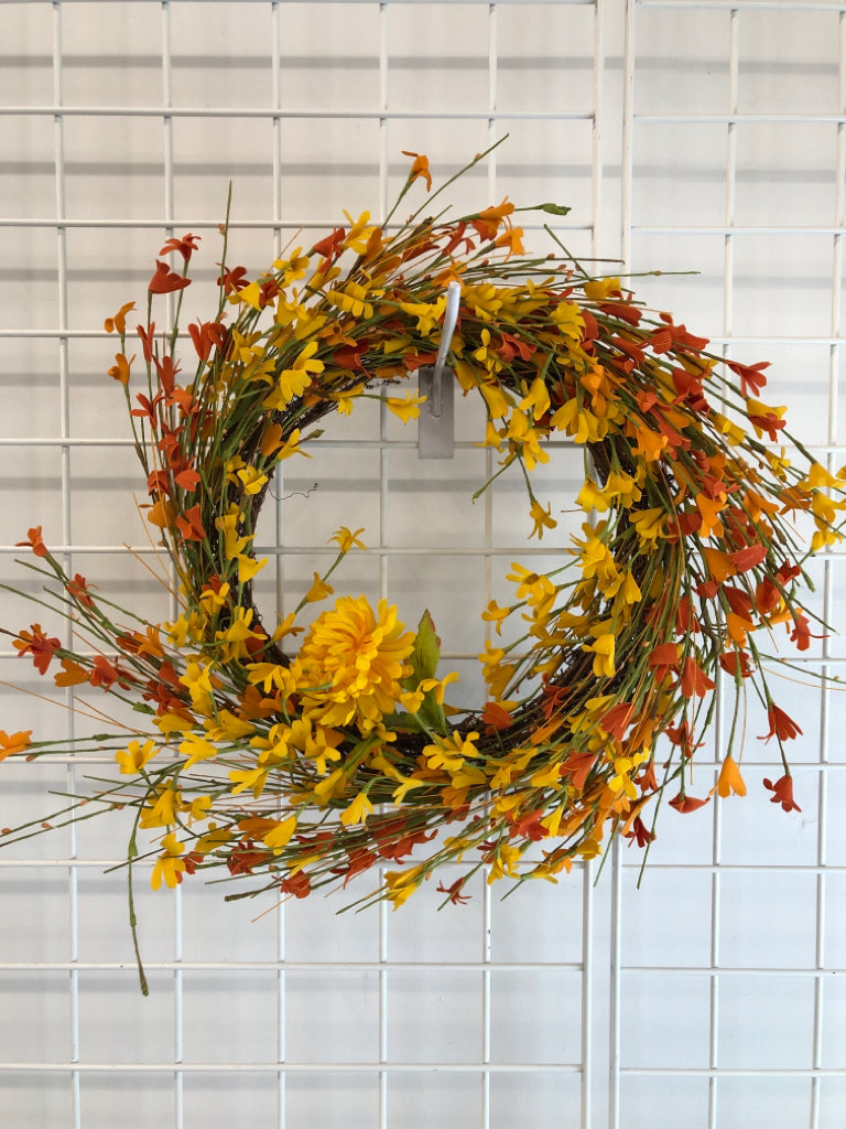 ORANGE/ YELLOW FLOWWRS STICK WREATH.