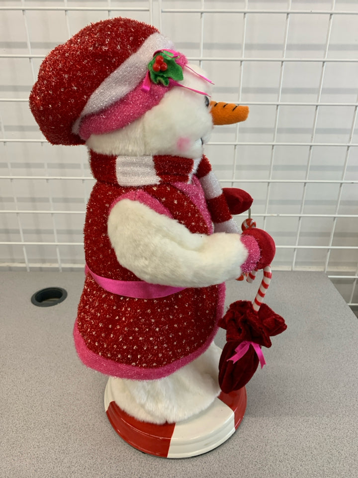 TWIRLING MUSICAL SNOWWOMAN.
