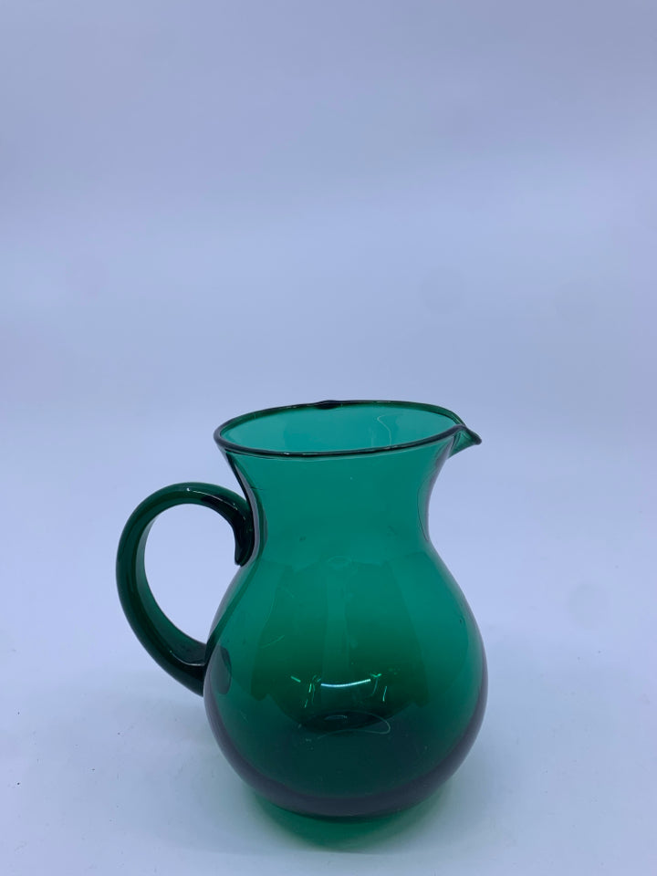 SMALL LIGHT GREEN GLASS PITCHER.