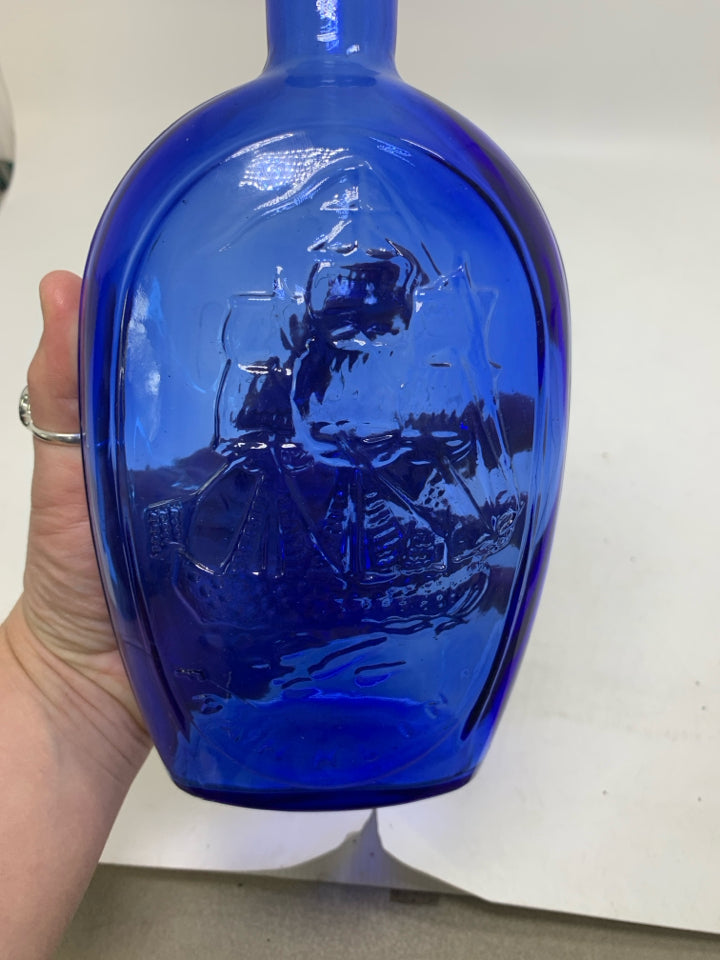 EMBOSSED SHIP BLUE GLASS BOTTLE EMPTY.