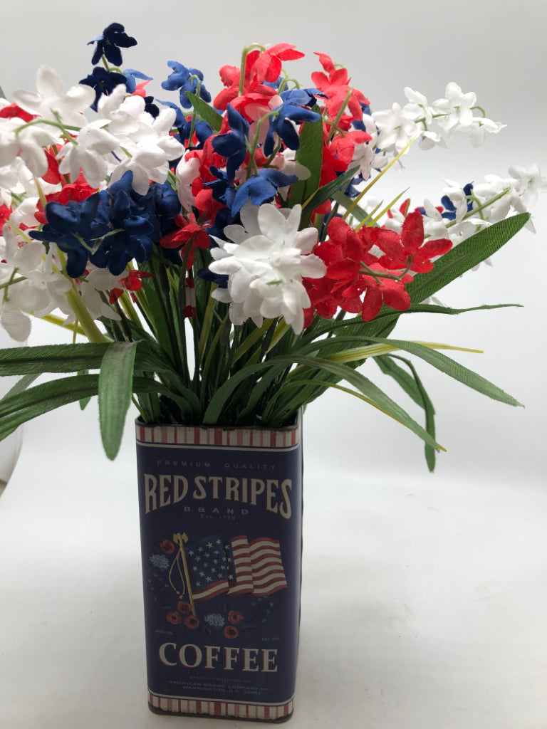 AMERICANA TIN W/ RED,WHITE,BLUE FAUX FLOWERS.