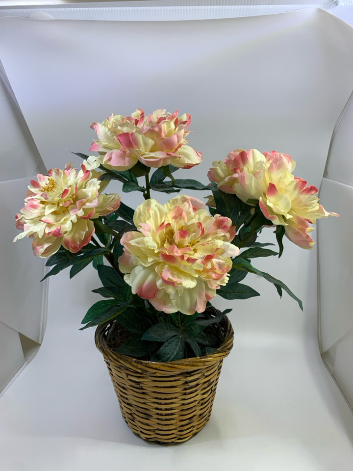 FAUX PINK FLOWER BOUQUET IN WOVEN BASKET.