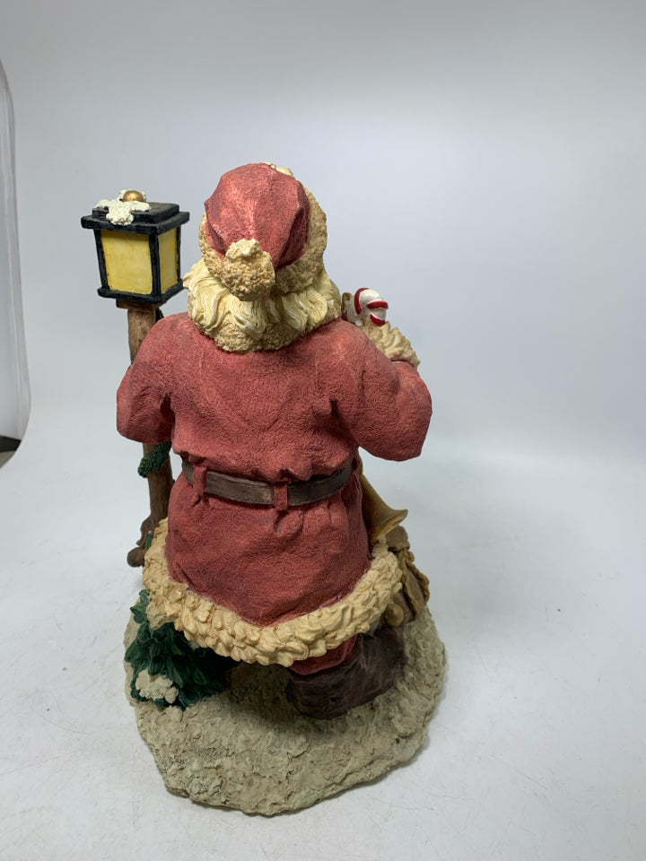 HEAVY RESIN SANTA W/ LAMP POST/ TOYS.