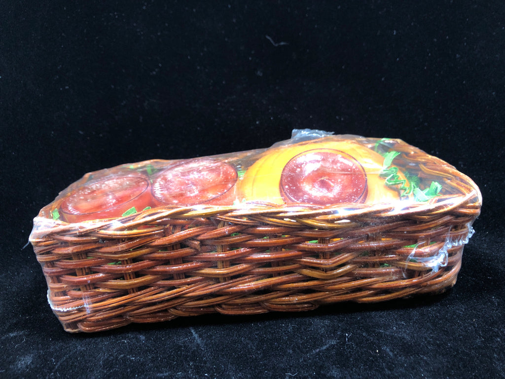 NIP PUMPKIN CANDLES IN BASKET.