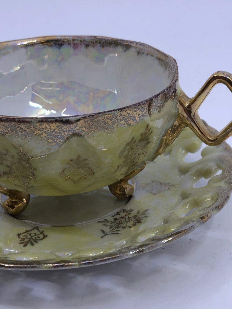 VTG PALE YELLOW W GOLD ACCENTS AND LACE PATTERN TEACUP AND SAUCER.