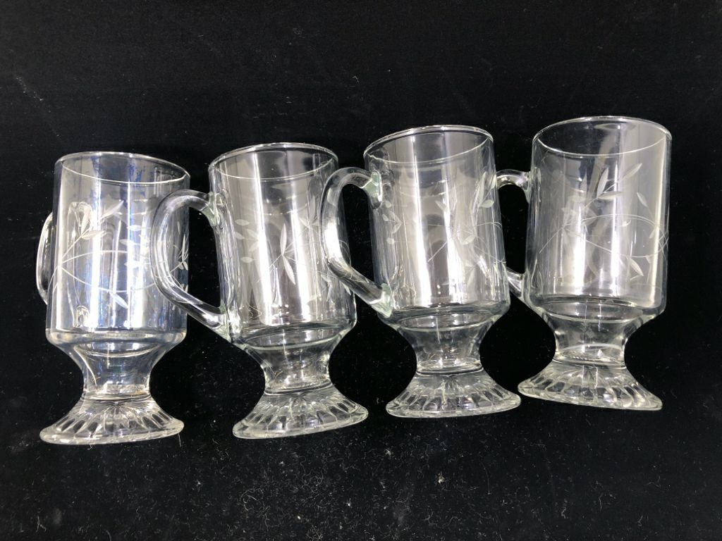 4 FLORAL ETCHED FOOTED IRISH COFFEE MUGS.