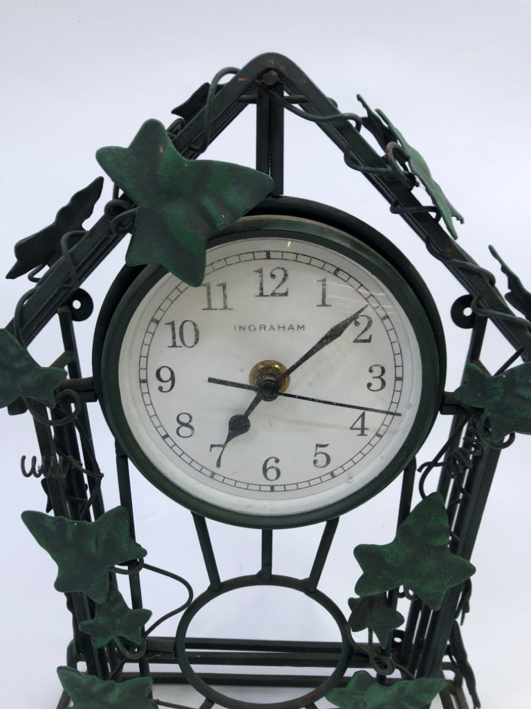 GREEN WIRE VINE CLOCK W/LEAVES.