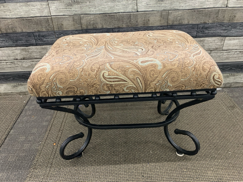 BROWN PAISLEY AND BLACK SCROLL BASE FOOTSTOOL.