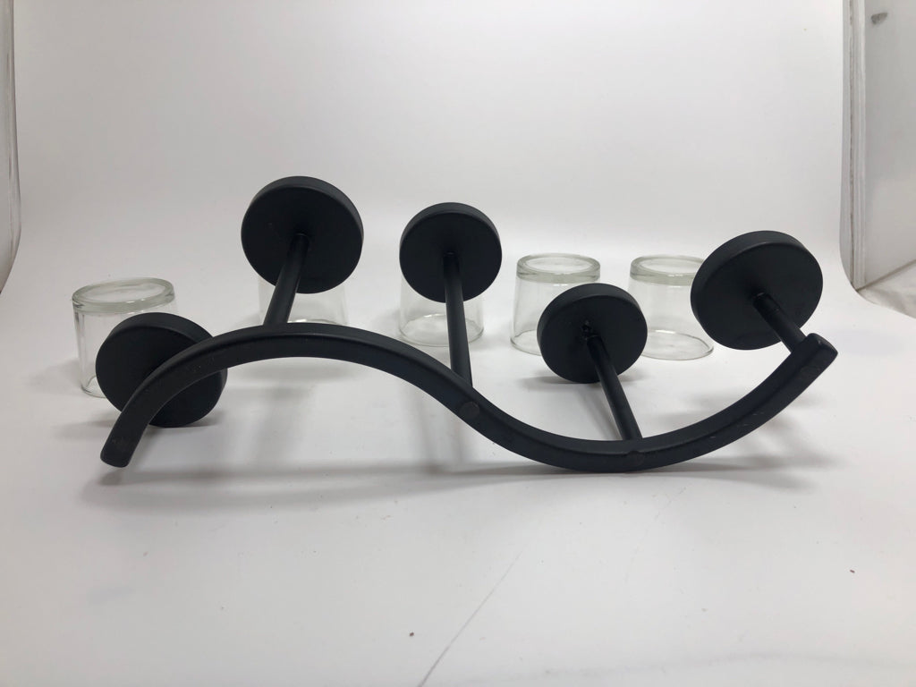 "S" SHAPE METAL TEALIGHT HOLDER.