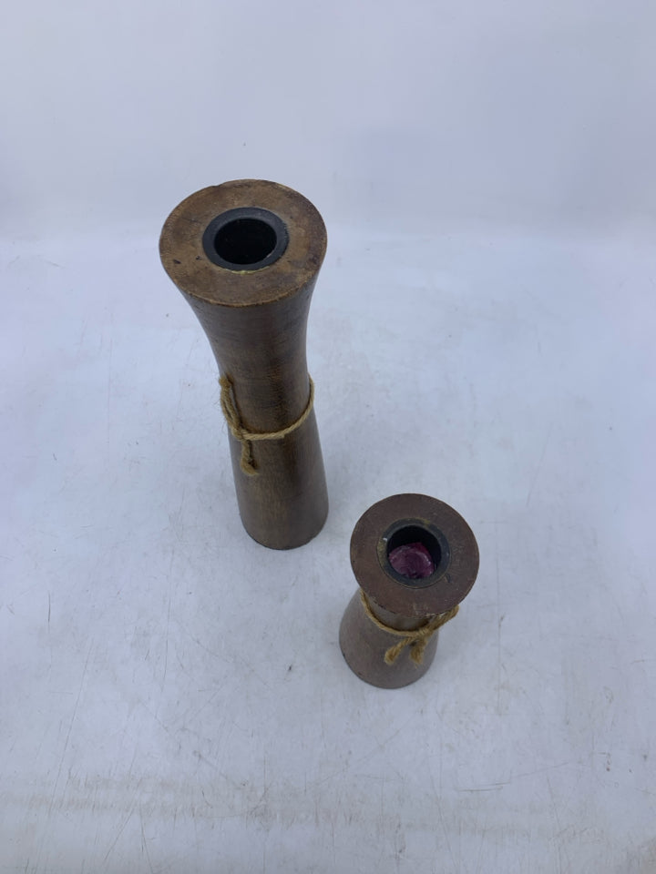 2 DARK WOOD TAPERED CANDLE HOLDERS.
