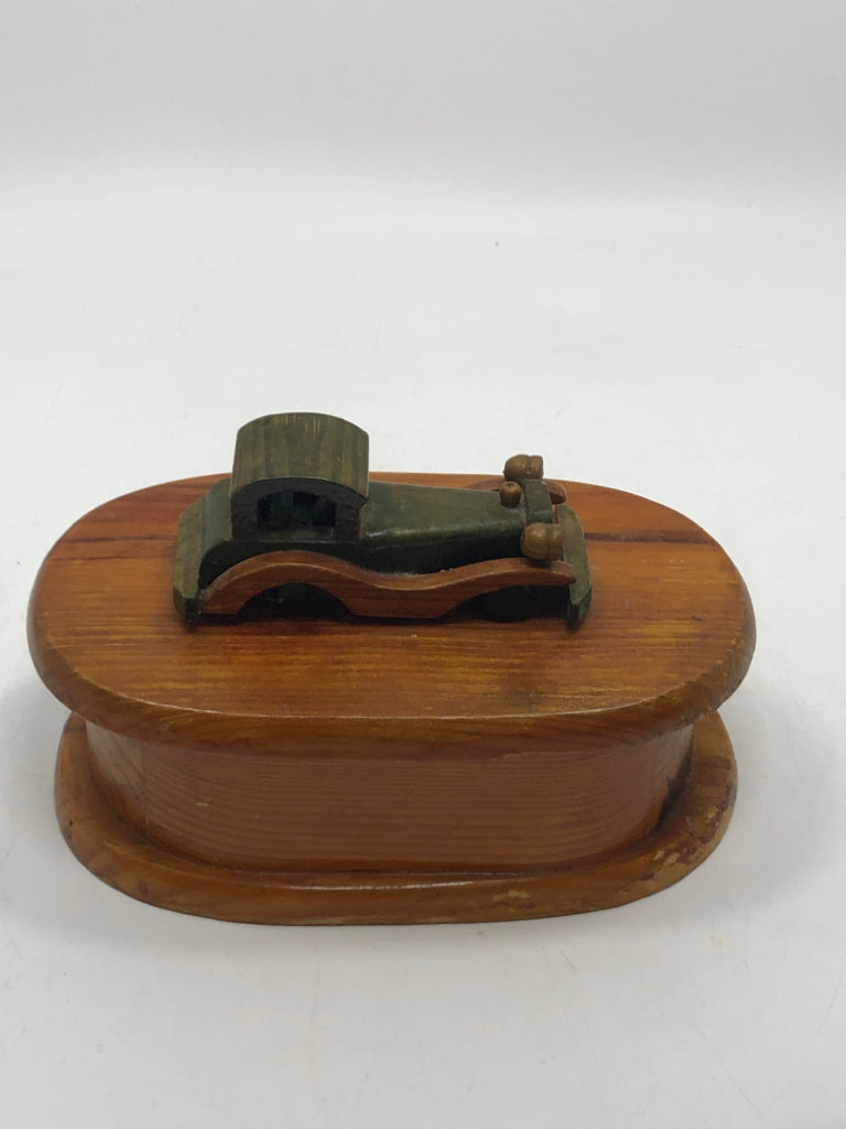 POLISHED WOODEN BOX WITH CAR ON TOP.