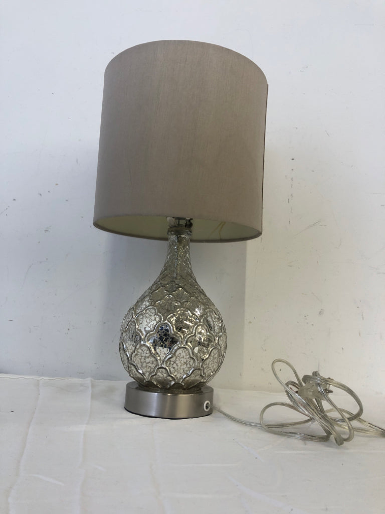 SILVER MERCURY BASE LAMP W TAN SHADE.