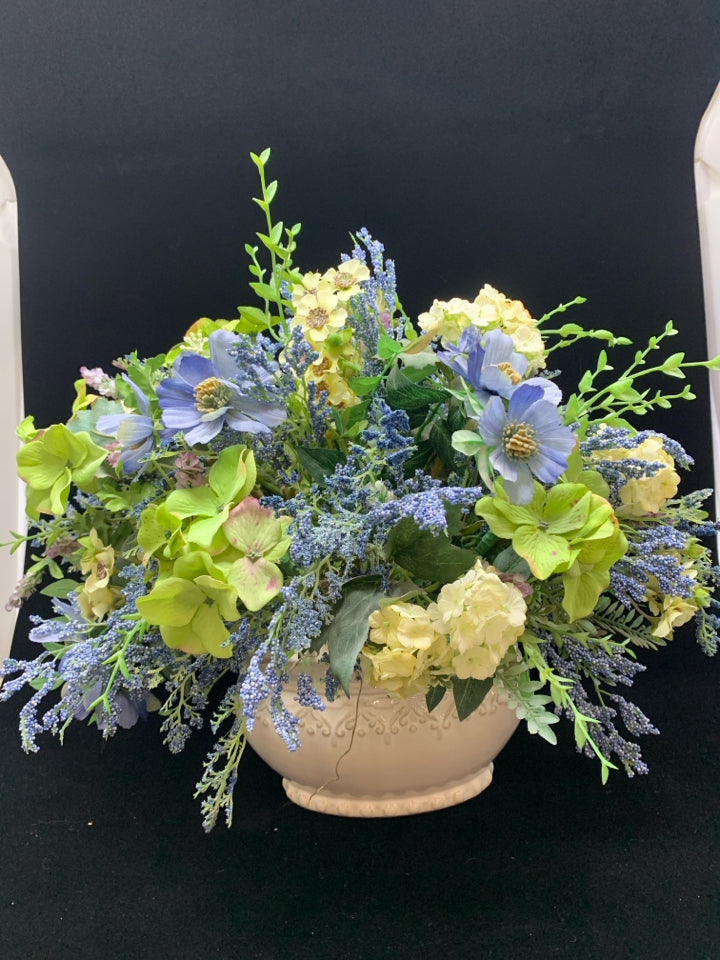 BLUE FLORALS IN WHITE PLANTER.