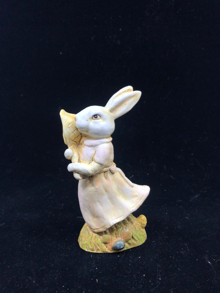 BUNNY HOLDING NET FIGURINE.