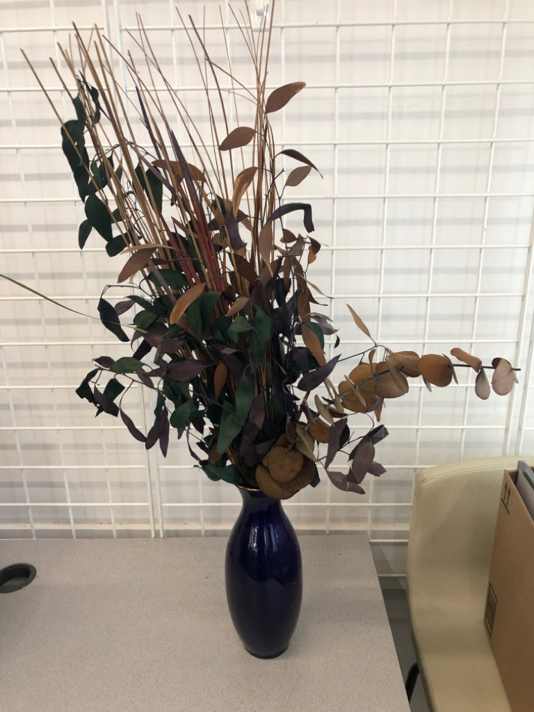 FAUX DARK FOLIAGE IN BLUE FLORAL VASE.