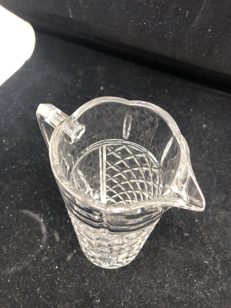 SMALL HEAVY GLASS PITCHER W HANDLE.