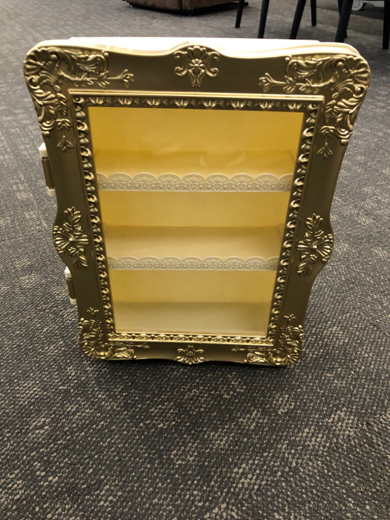 3 TIER SHELF W/GOLD PAINTED DOOR.
