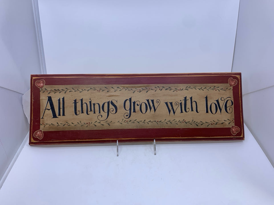 "ALL THINGS GROW WITH LOVE" WALL HANGING.