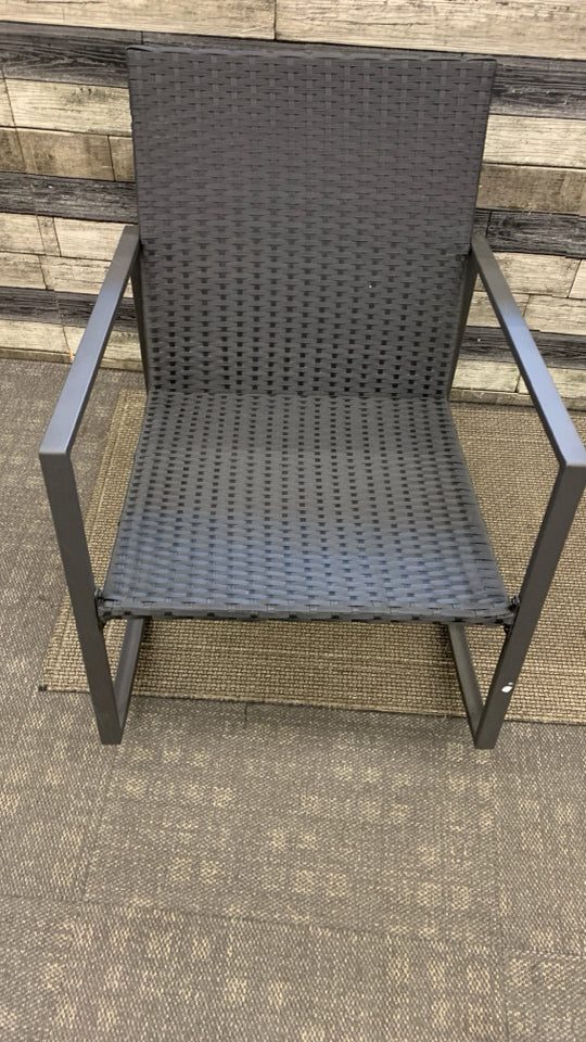BLACK WICKER OUTDOOR ROCKING CHAIR.