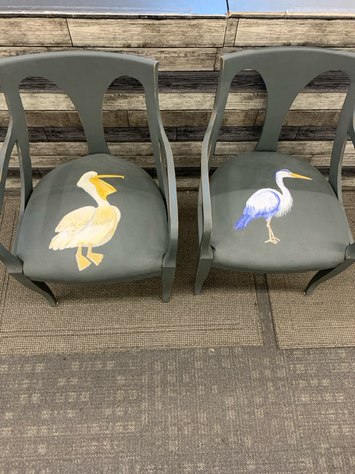 2 REFURBISHED DARK GREY ACCENT CHAIRS W/ PAINTED SEA BIRDS ON SEAT.