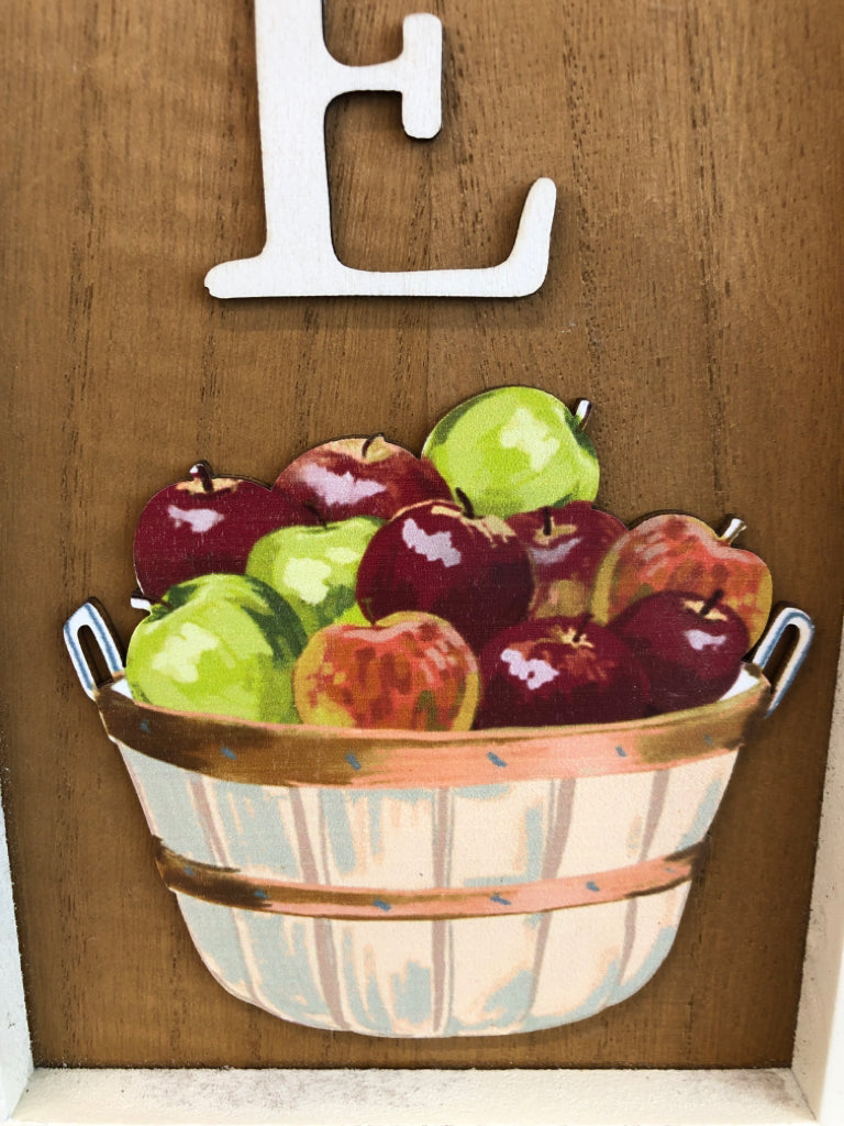 WELCOME SIGN W APPLES IN WOOD FRAME.