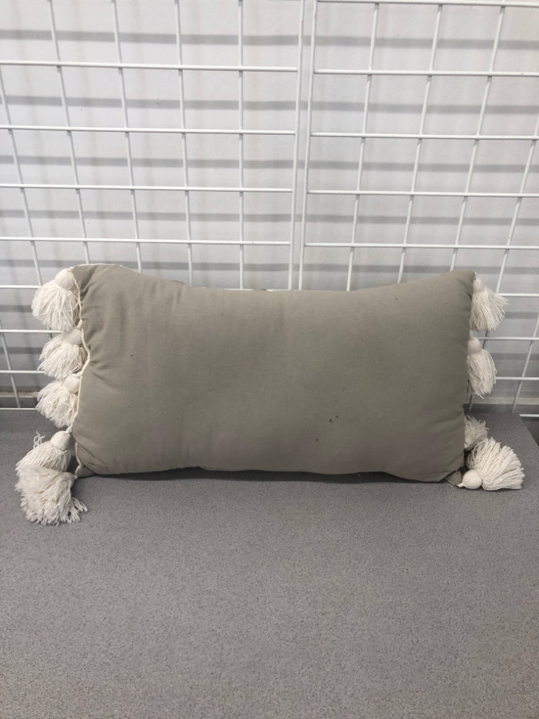 GREY STRIPE PILLOW W/TASSLES AND BRAID DETAIL.