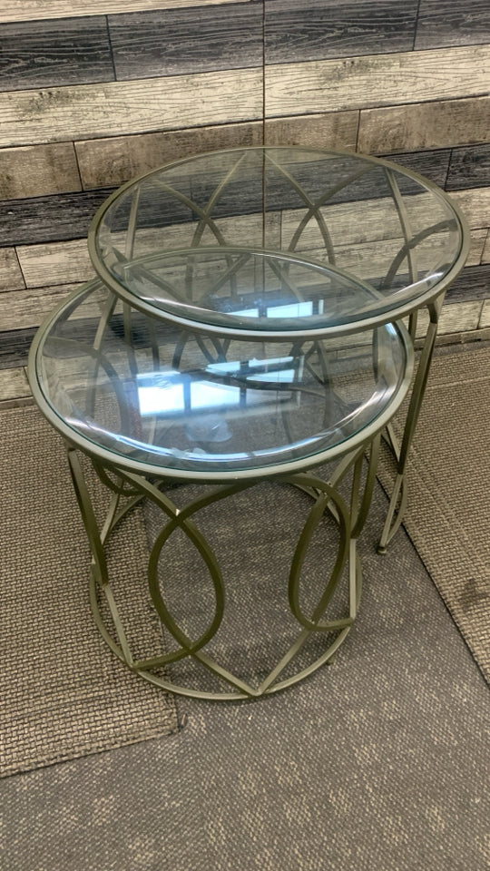 2PC ROUND GLASS STACKING TABLES W/METAL LEGS.