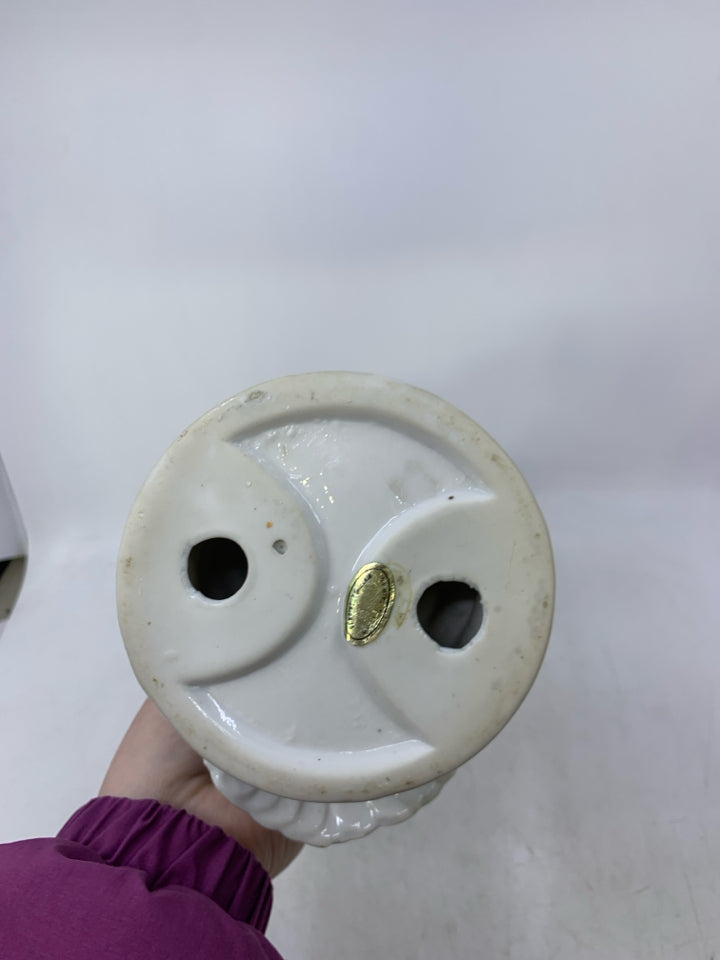 CERAMIC PIGEON ON ROCKS.