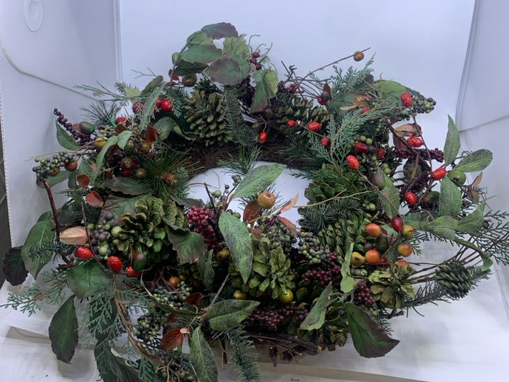 WREATH W BERRIES AND PINE.