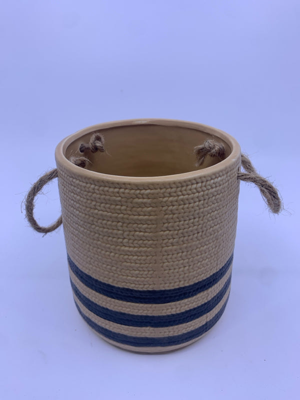 BROWN AND BLACK CERAMIC PLANTER WITH ROPE HANDLES.