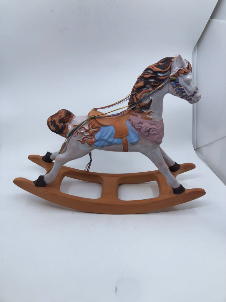 TERRACOTTA PAINTED ROCKING HORSE.