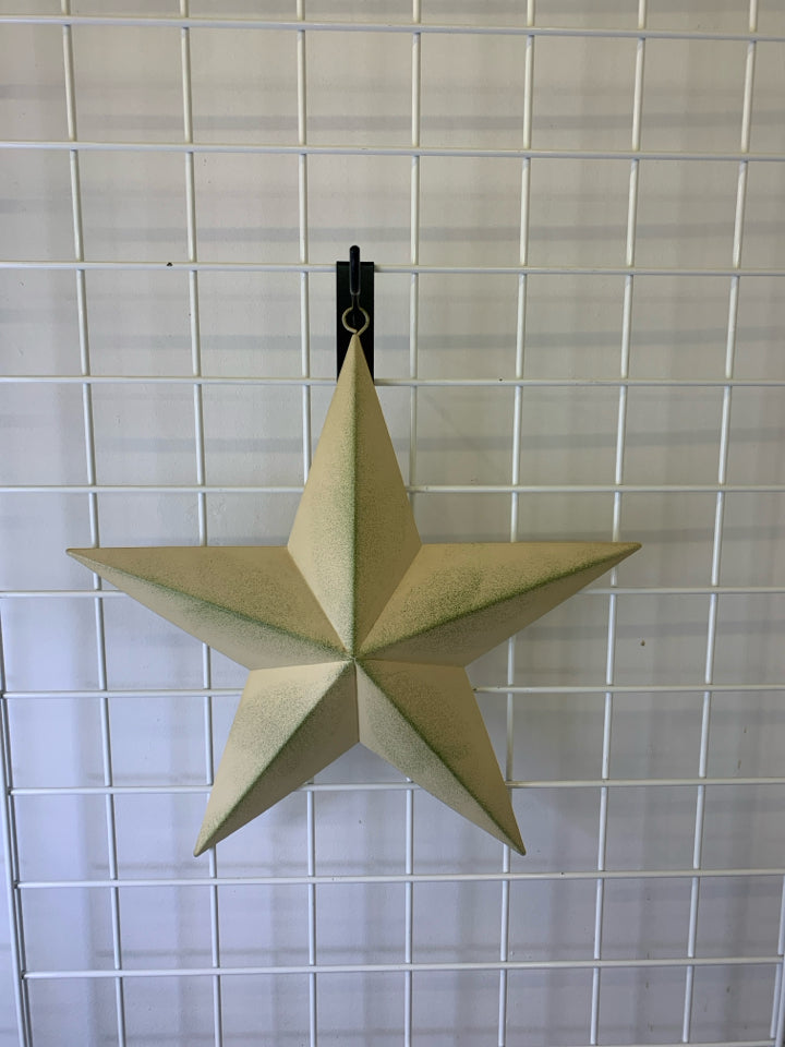 CREAM AND GREEN METAL STAR.