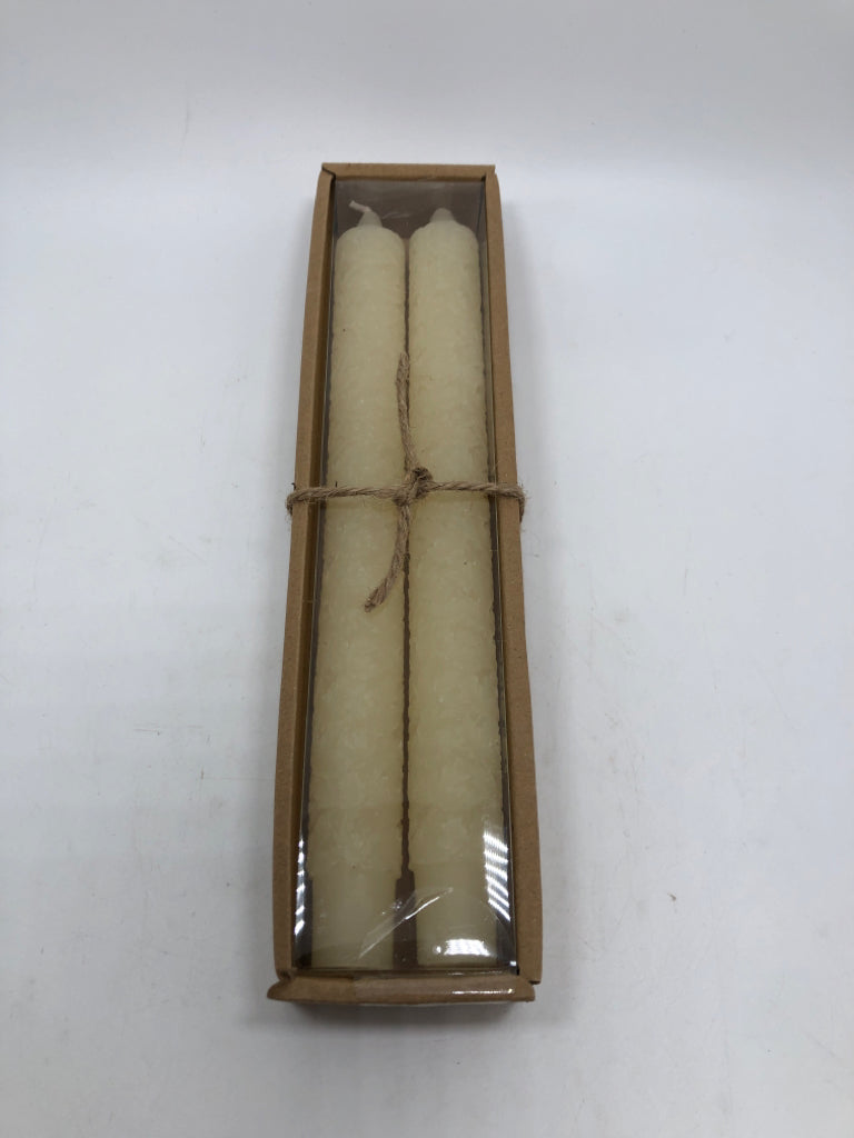 NIP 2PC CREAM TAPER CANDLES.