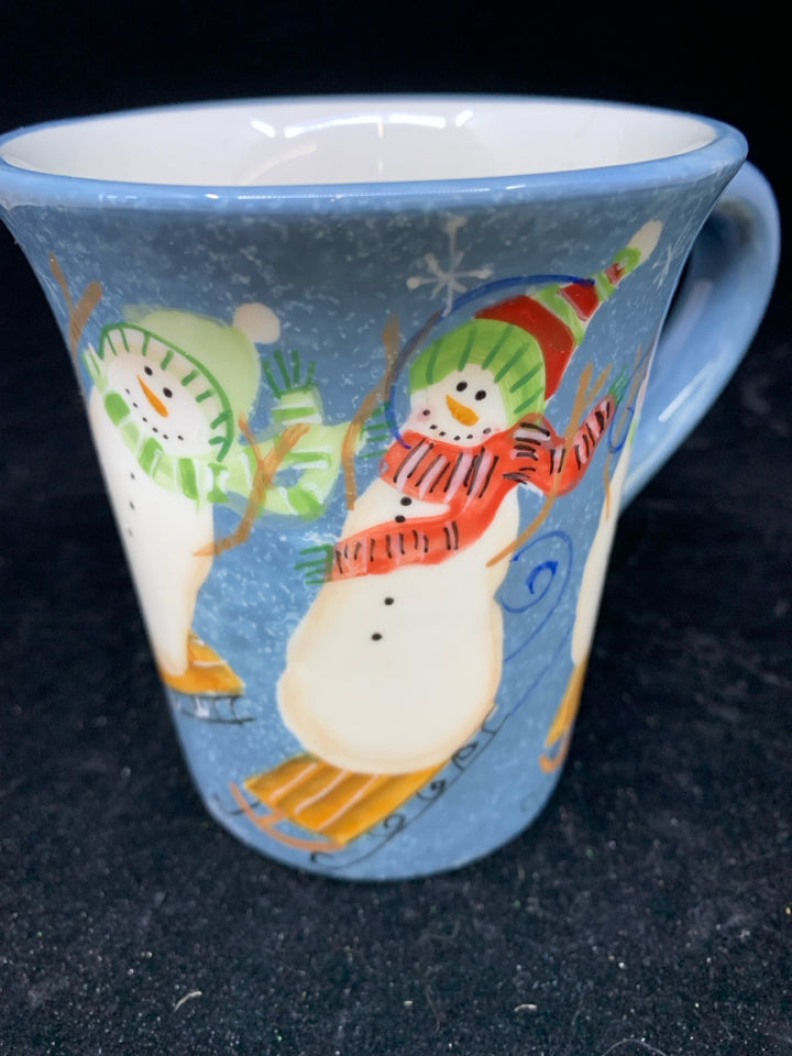 SNOWMEN ON SLEDS BLUE MUG.