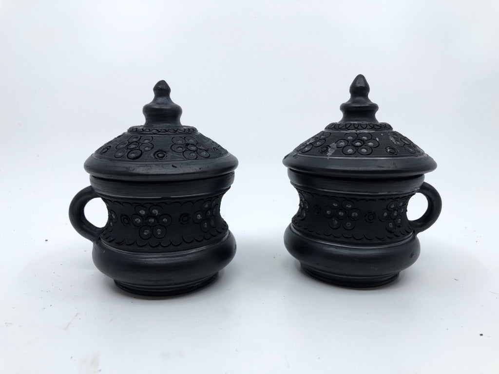 6PC BLACK CARVED TEA SET -PITCHER, CUPS W LID, SUGAR AND CREAMER ON PLATE.