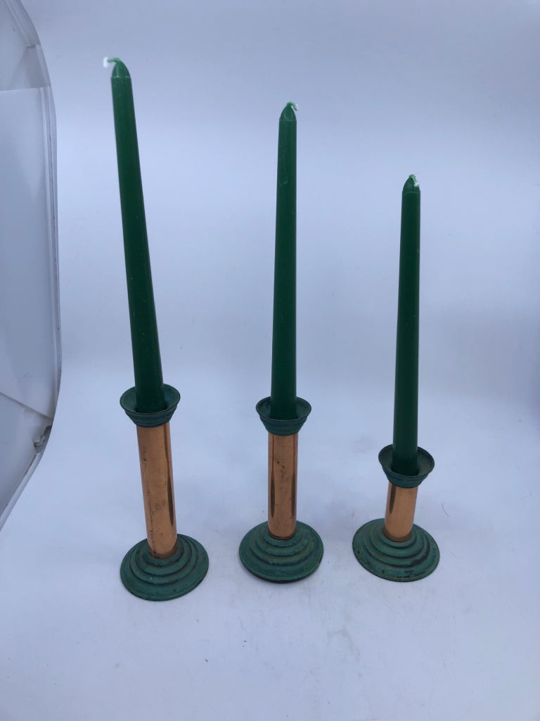 3 COPPER CANDLE HOLDERS W CANDLES.