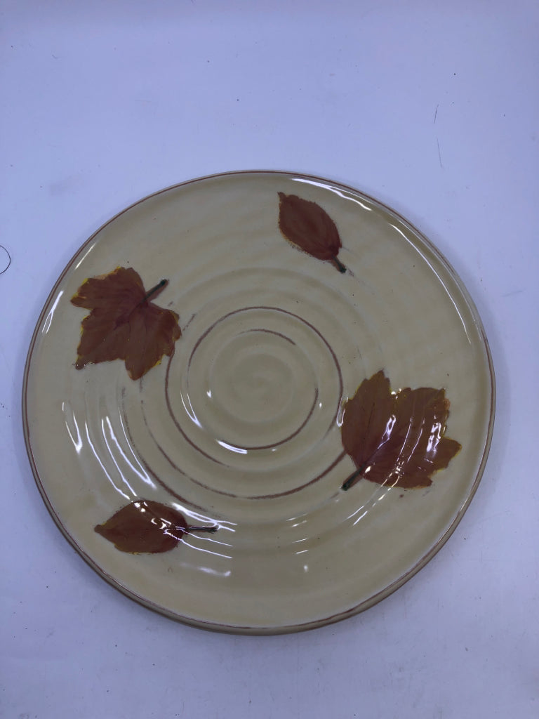 YELLOW ROUND SERVER W LEAVES.