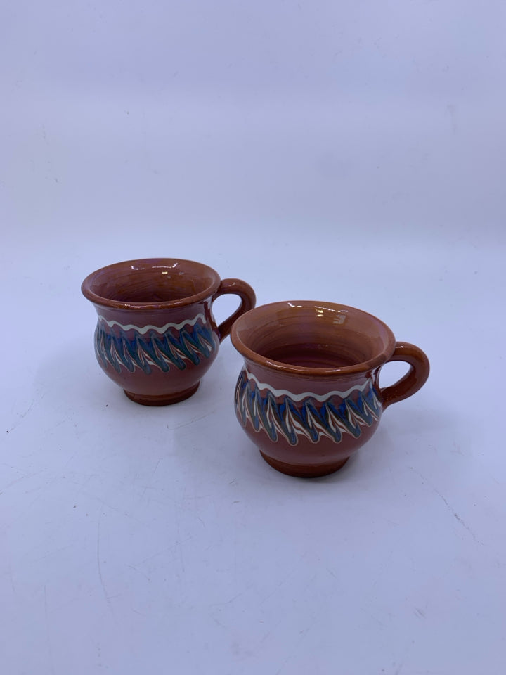 2 TERRA COTTA SHORT MUGS W/ BLUE/WHITE LINES.