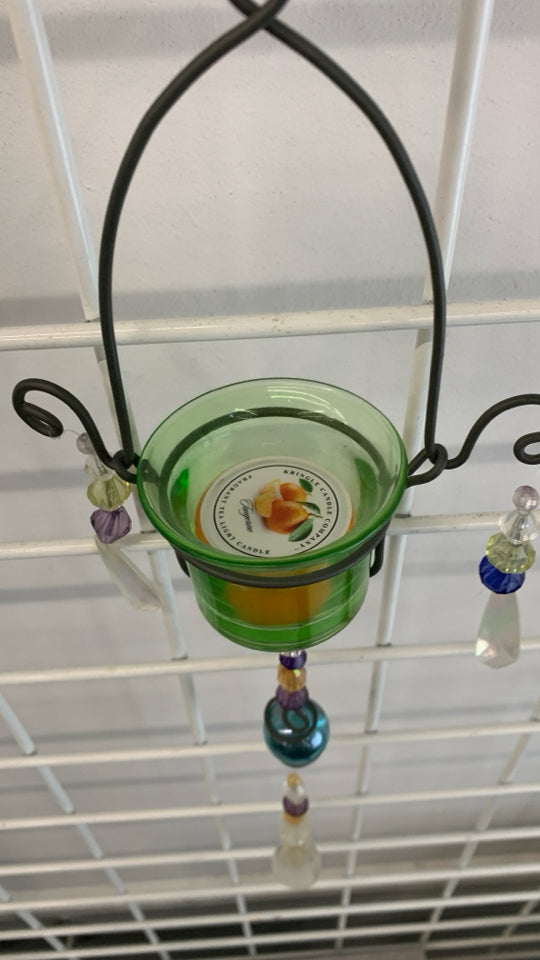 METAL+GLASS BEADED VOTIVE HOLDER W/ORANGE SCENTED CANDLE.