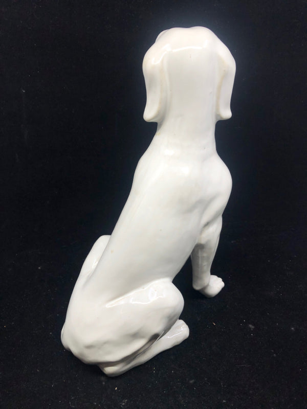 WHITE CERAMIC SITTING DOG.