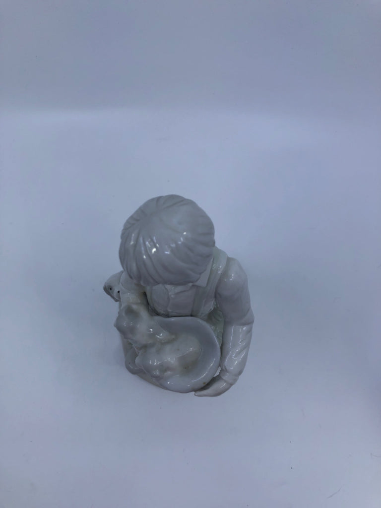 BOY W/DOGS PORCELAIN FIGURINE.