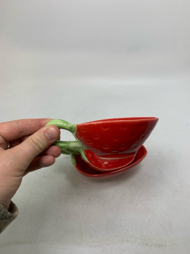 3 CERAMIC STRAWBERRY SHAPED NESTING BOWLS W/ HANDLES.